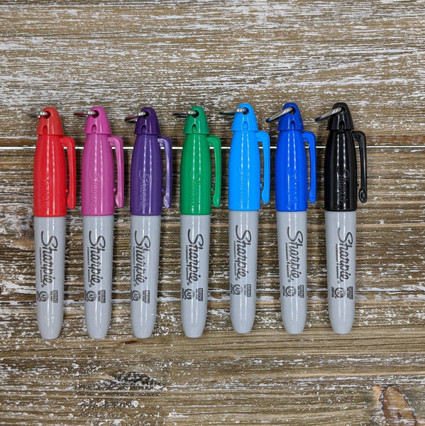 Mini Keychain Sharpies in Red, Pink, Purple, Green, Light Blue, Dark Blue, and Black.